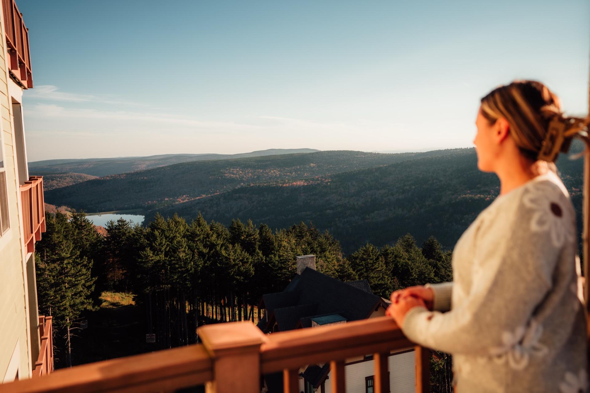 Austin and Sarah on a deck above the Snowshoe valley at golden hour