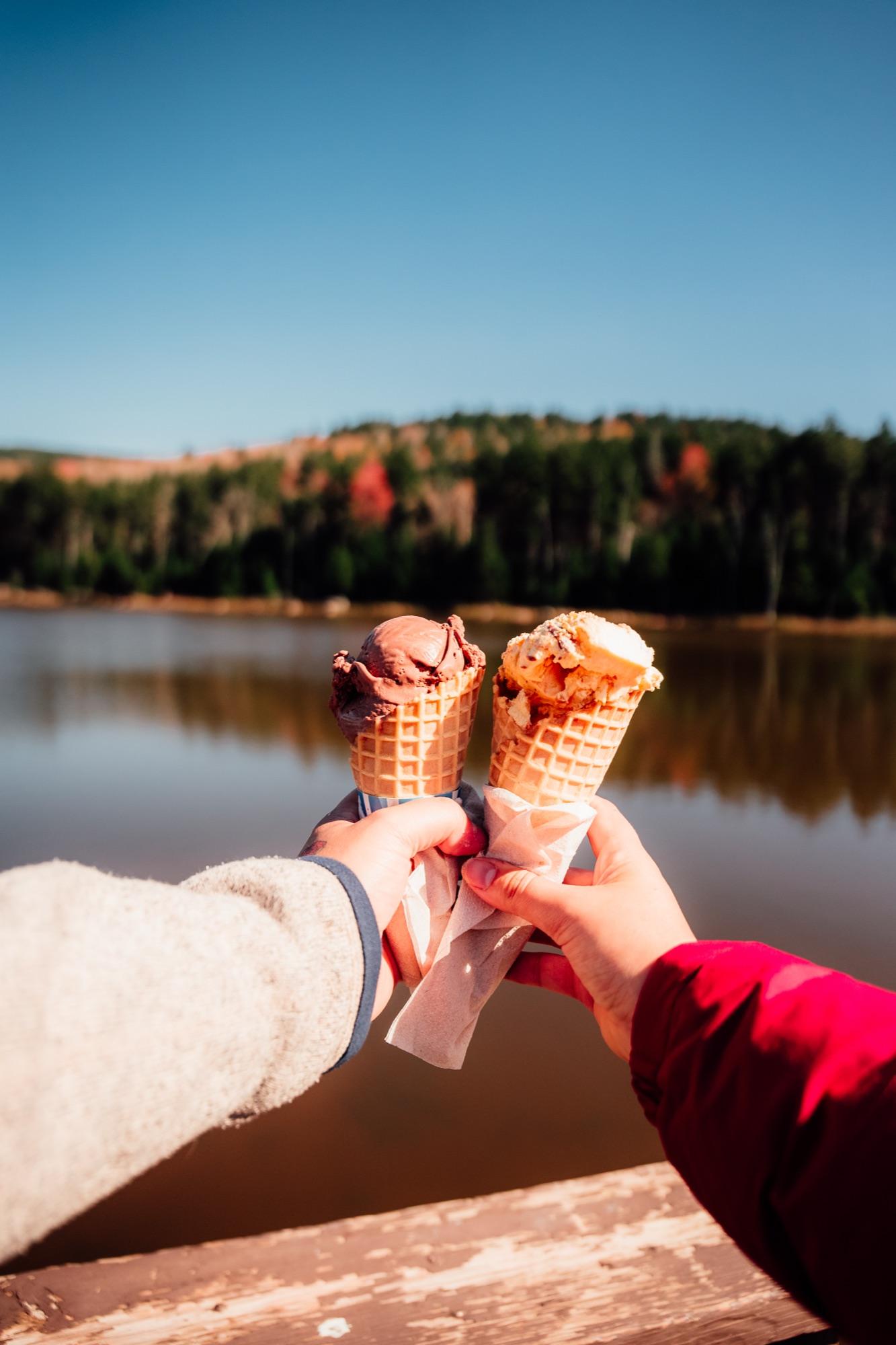 Ice cream cones held up at Shavers Lake on a summer afternoon