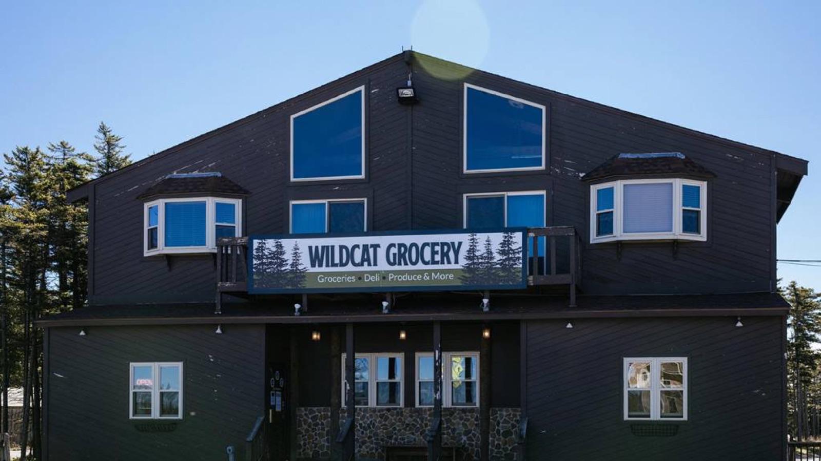 The Wildcat Grocery building on the mountain on a clear summer day