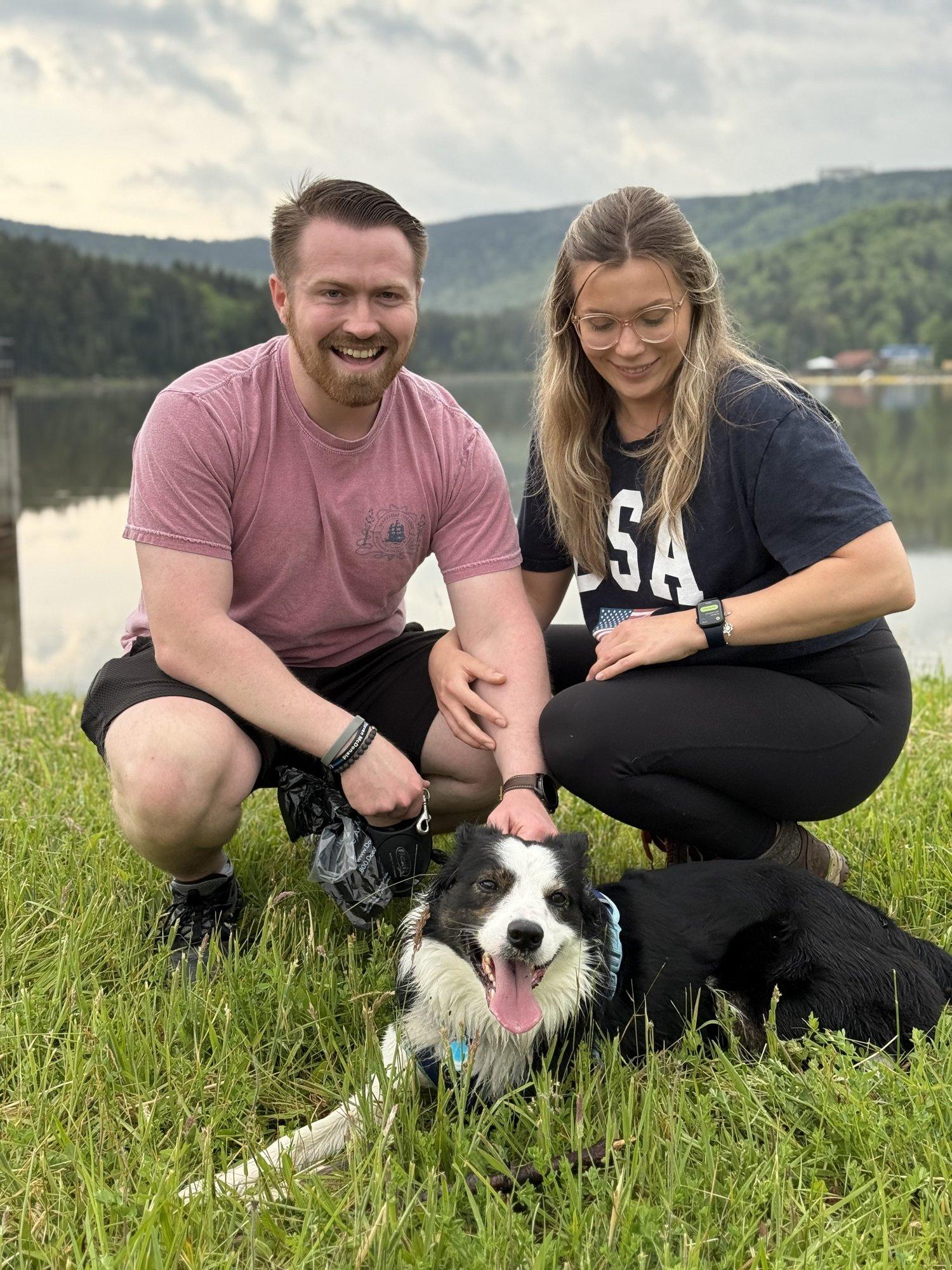 Two hikers and their dog on the trail above Shavers Lake