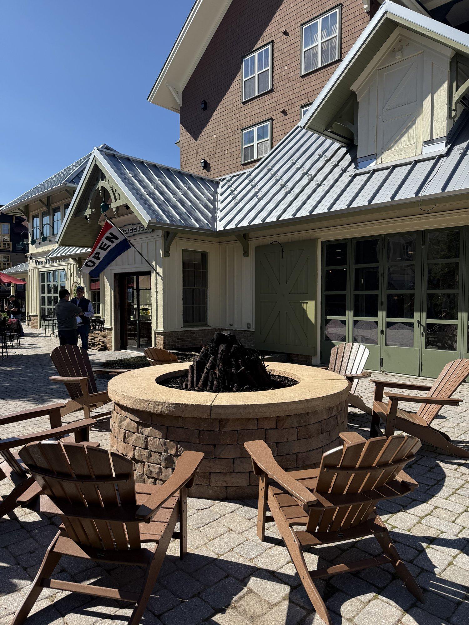 Adirondack chairs around the fire pit in the Village at Snowshoe